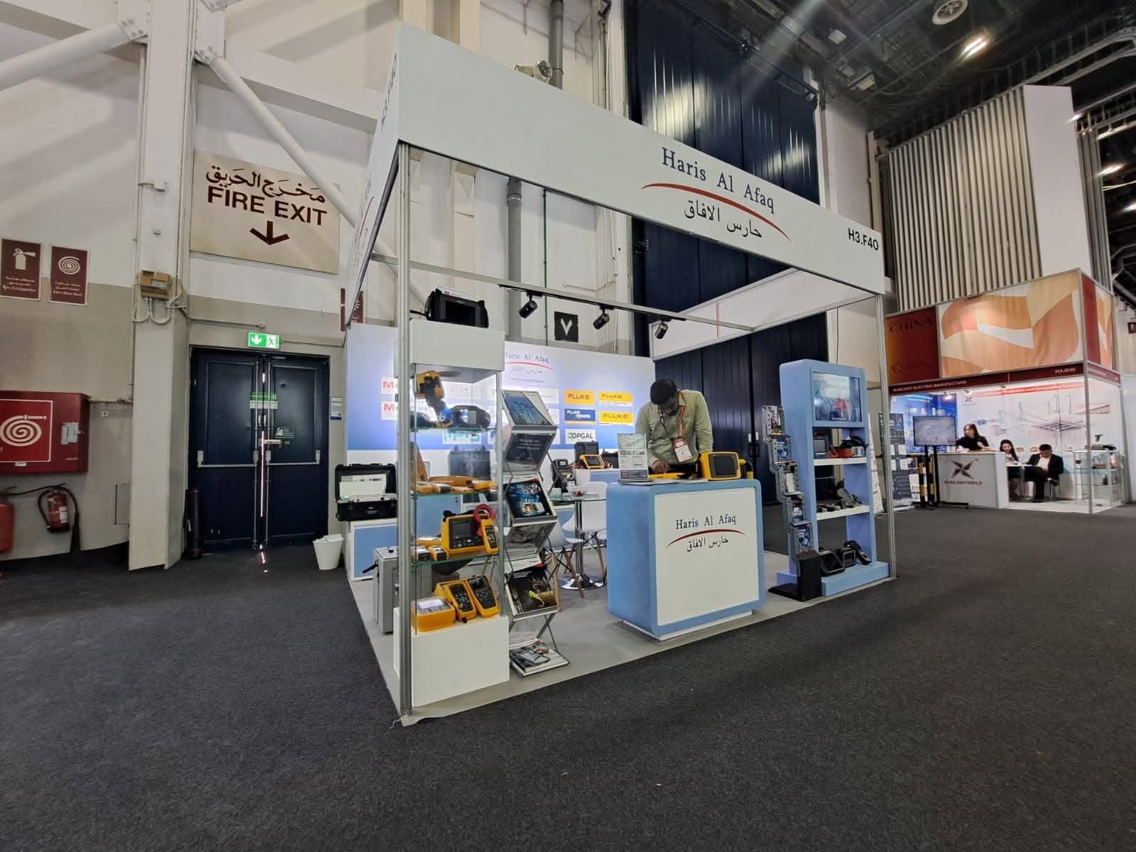 Haris Al Afaq instrumentation stand, an open aluminium portal over glass cabinets of test equipment