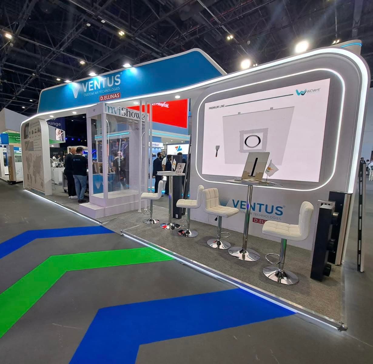 Ventus custom air technologies stand, a rounded white shell with an illuminated product diagram and bar seating