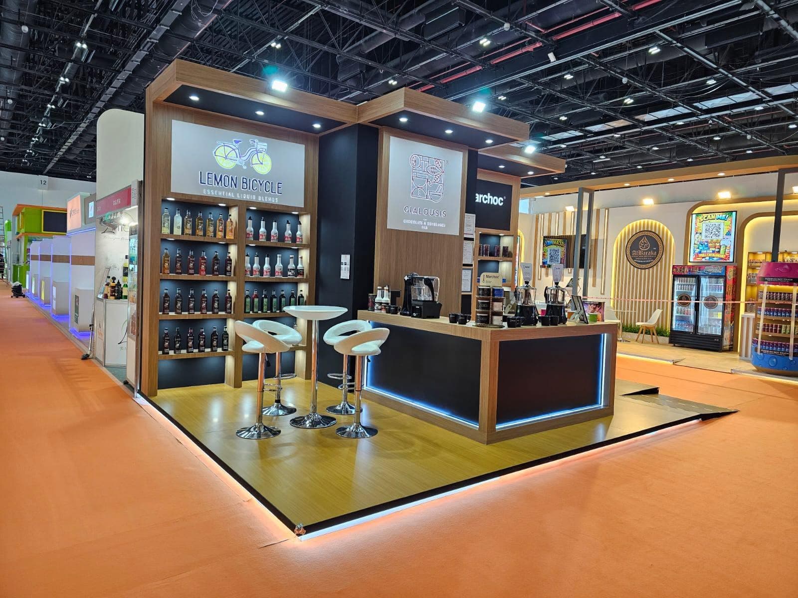 Backlit printed shelving and branded tasting bar on a beverage stand built by IMI